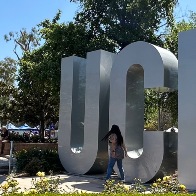 Highlander Day UCR sign with students