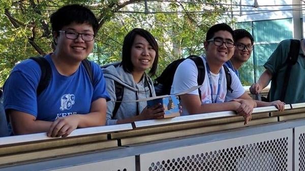 undergraduate students on a walkway bridge undergraduate students on a walkway bridge