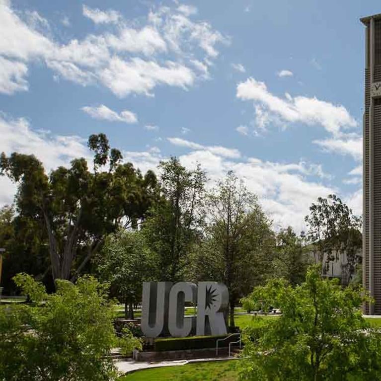 UCR campus with bell tower and sign
