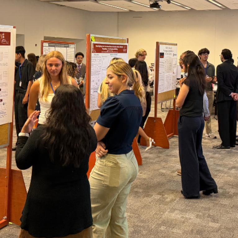 Students and guests at the RISE Symposium Poster Session