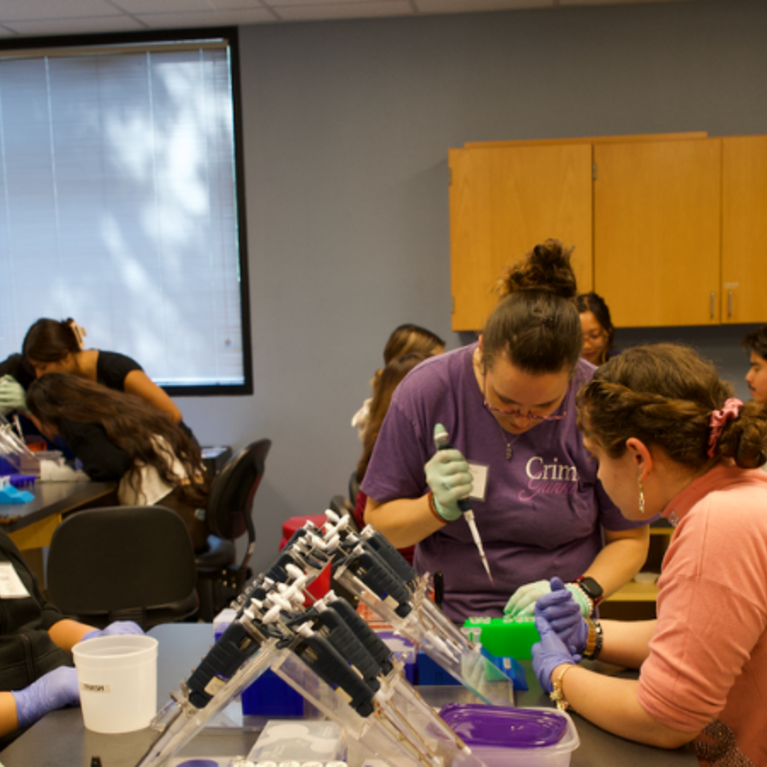 Students doing lab work with the Sequencing to Success program