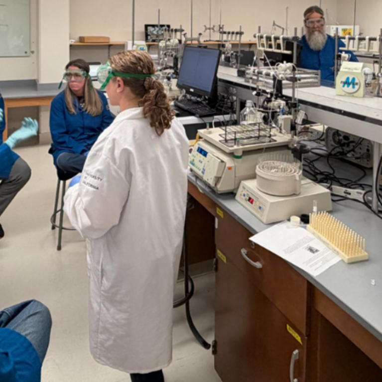 Dr. Stephanie Dingwall with local science teachers in the biochemistry lab