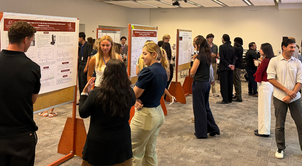 Students and guests at the RISE Symposium Poster Session