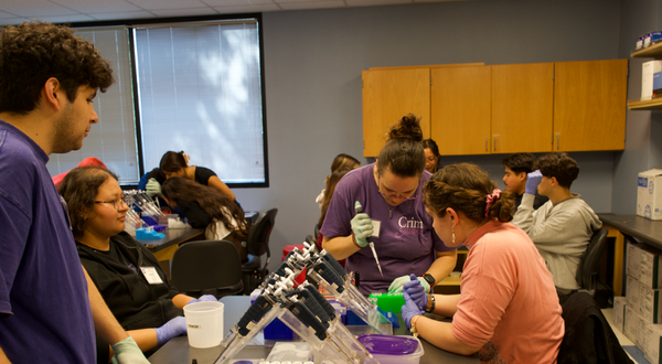 Students doing lab work with the Sequencing to Success program