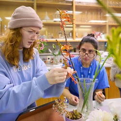 Undergraduate Majors Genetics and Molecular Biotechnology Students Looking at a Plant Specimen.