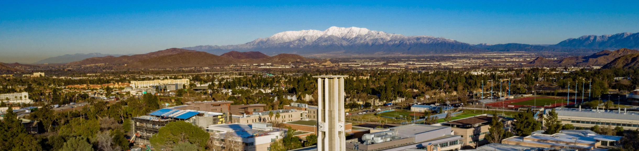 UCR Bell Tower with snow-capped mountains