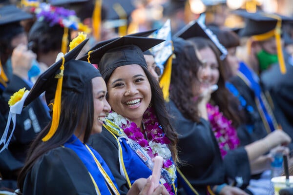 CNAS students sitting on Pierce Lawn during commencement ceremony