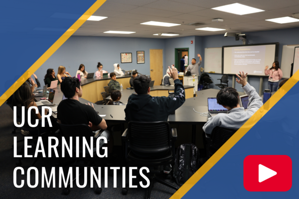 CNAS Learning Communities Class With Students Raising Hands