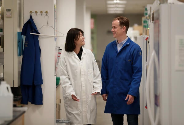 CNAS professor & student talking in lab