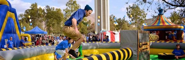 Homecoming, jumping in front of Belltower (c) UCR