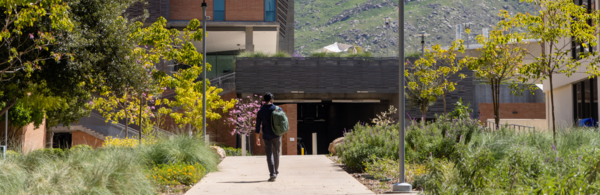 CNAS student walking towards academic building