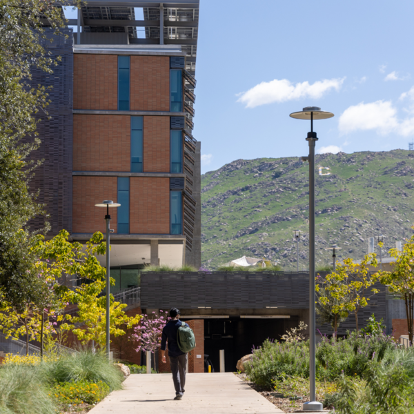 CNAS student walking towards academic building