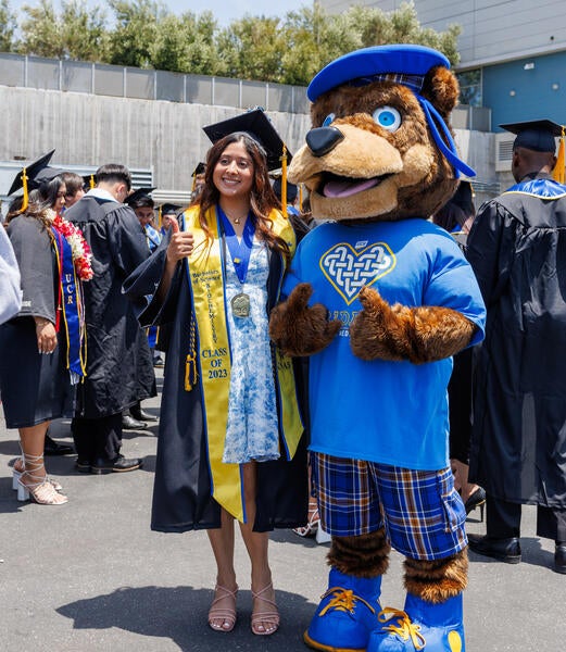 Student with Scotty at 2023 CNAS Commencement Ceremony at Toyota Arena