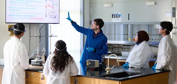 Professor and students in the lab.