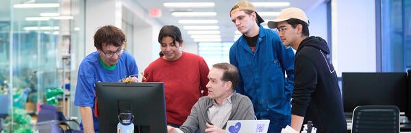 CNAS Scholarships Students with Professor