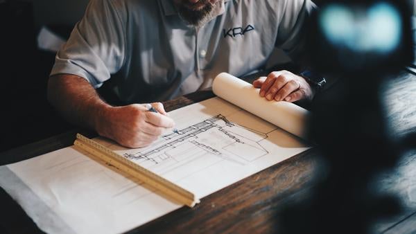 engineer drawing a plan for construction (c) Daniel McCullough Unsplash