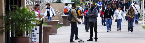 students conversing outdoors in between classes