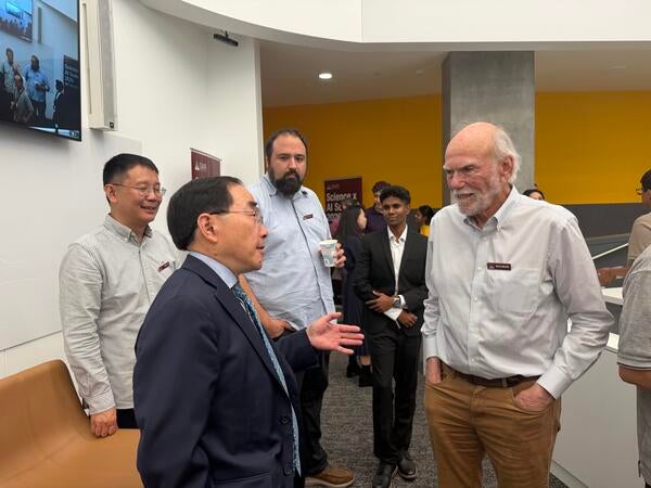 Chancellor Hu talking with Professor Barry Barish at the Science X AI Summit