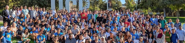 International students group in front of UCR sign