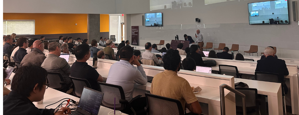 Lecture hall filled with attendees for the Science x AI Summit held at UC Riverside