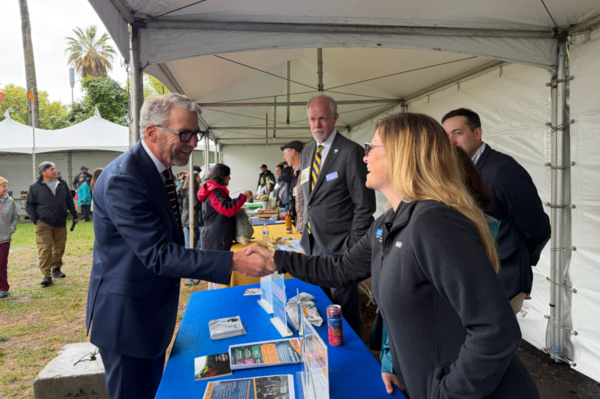 James B. Milliken, President of the University of California, greets CNAS student Angel Zarobinski during California Agricultural Day at the Capitol in Sacramento. Also pictured are CNAS Dean Peter Atkinson, Houston Wilson, Associate Professor in the Department of Entomology, and Patricia Springer, Divisional Dean for Agriculture and Natural Resources.