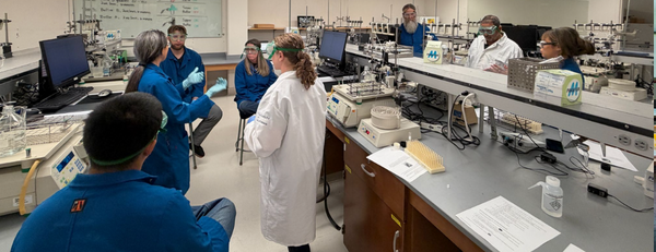 Dr. Stephanie Dingwall with local science teachers in the biochemistry lab