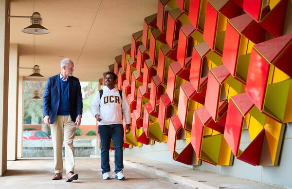 CNAS Dean with current student outside Genomics building