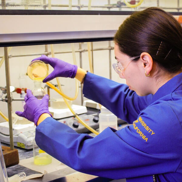 Undergraduate Majors Chemistry Student in Lab Pouring