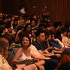 Attendees waiting for a lecture to begin.