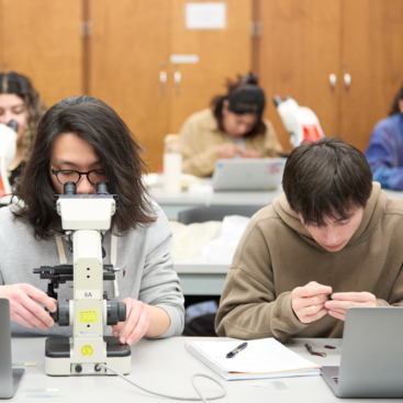 Students in Batchelor Hall using microscopes