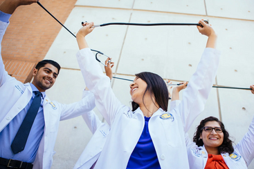 UC Riverside students with lab coats and stethoscopes