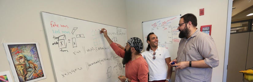 Data Science major: Professor Vagelis Papalexakis of computer science and engineering works with students to solve a data science problem